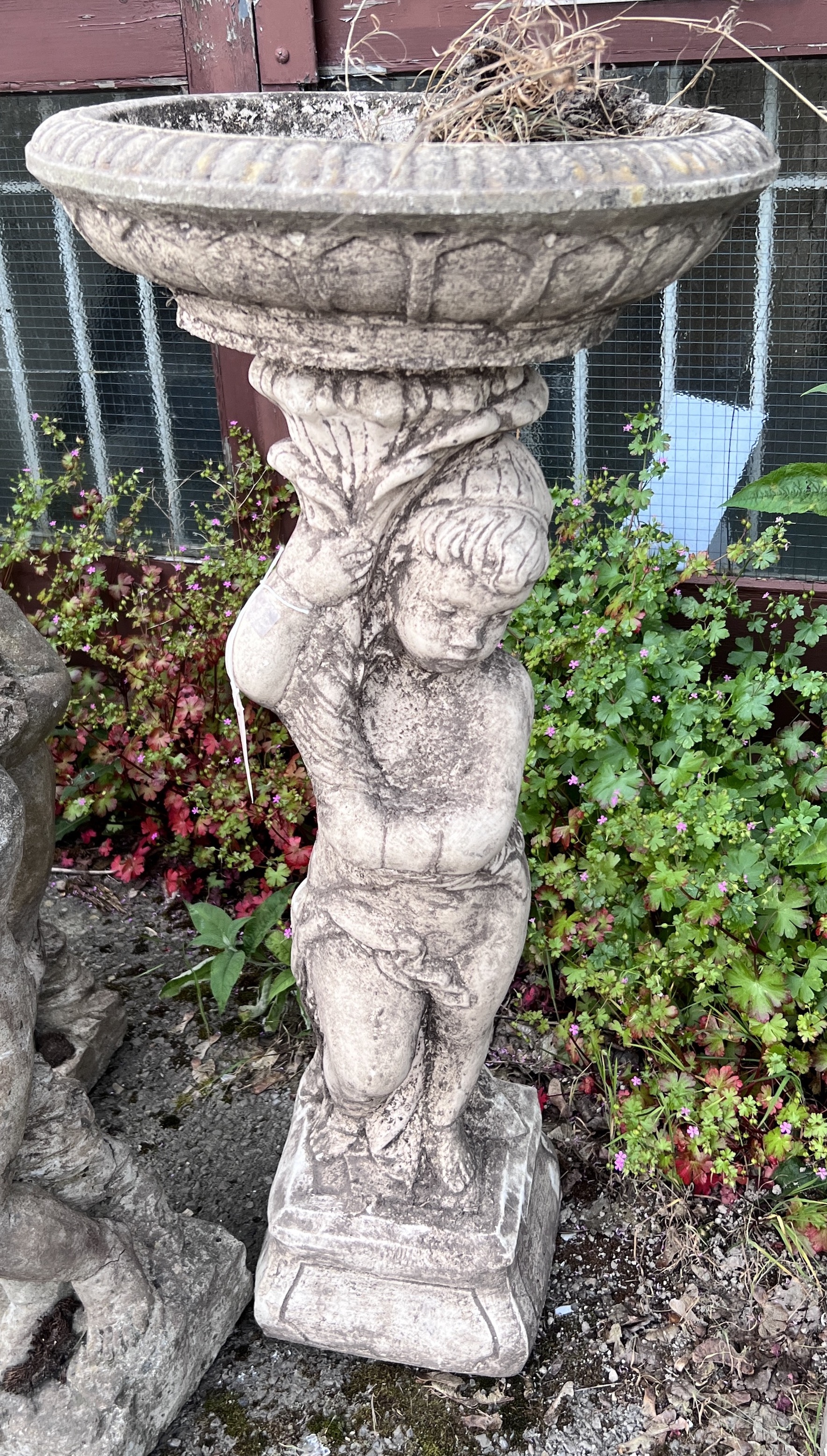 A circular cast stone cherub fountain bird bath, height 92cm